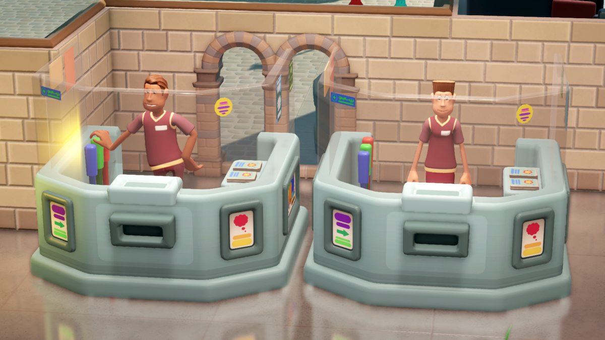 Two assistants standing in ticket booths in two point museum